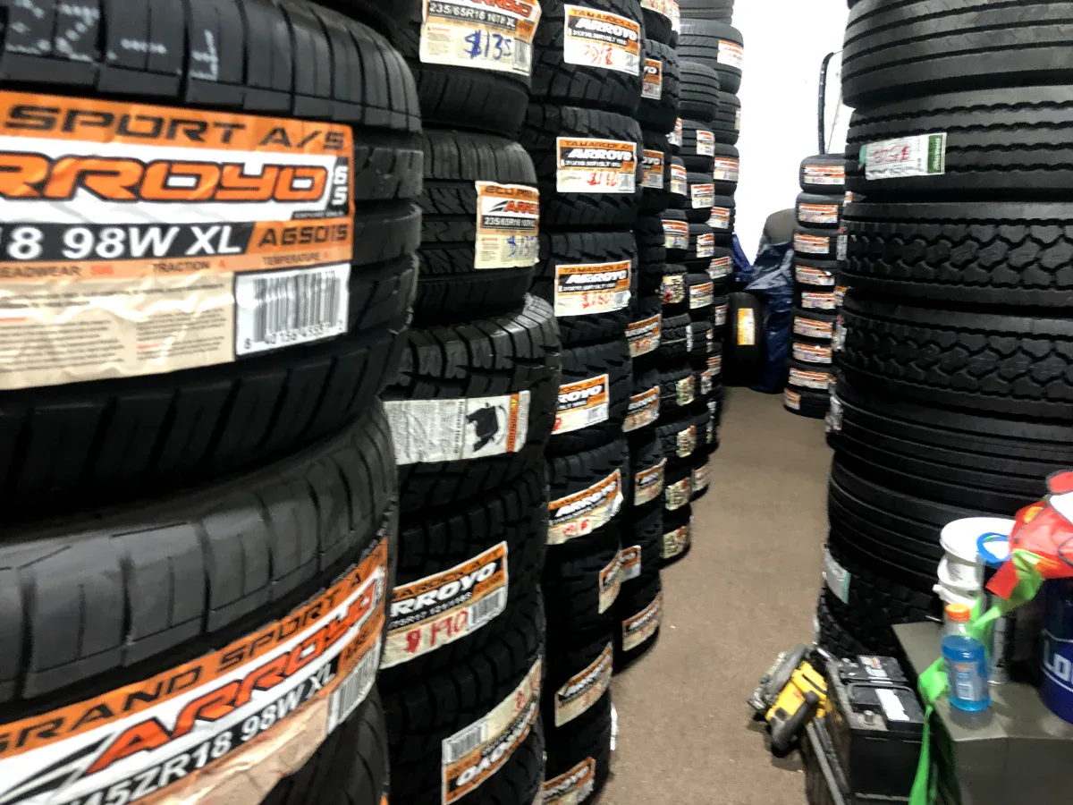 Rows of real tire inventory available at Edwin Tire Shop